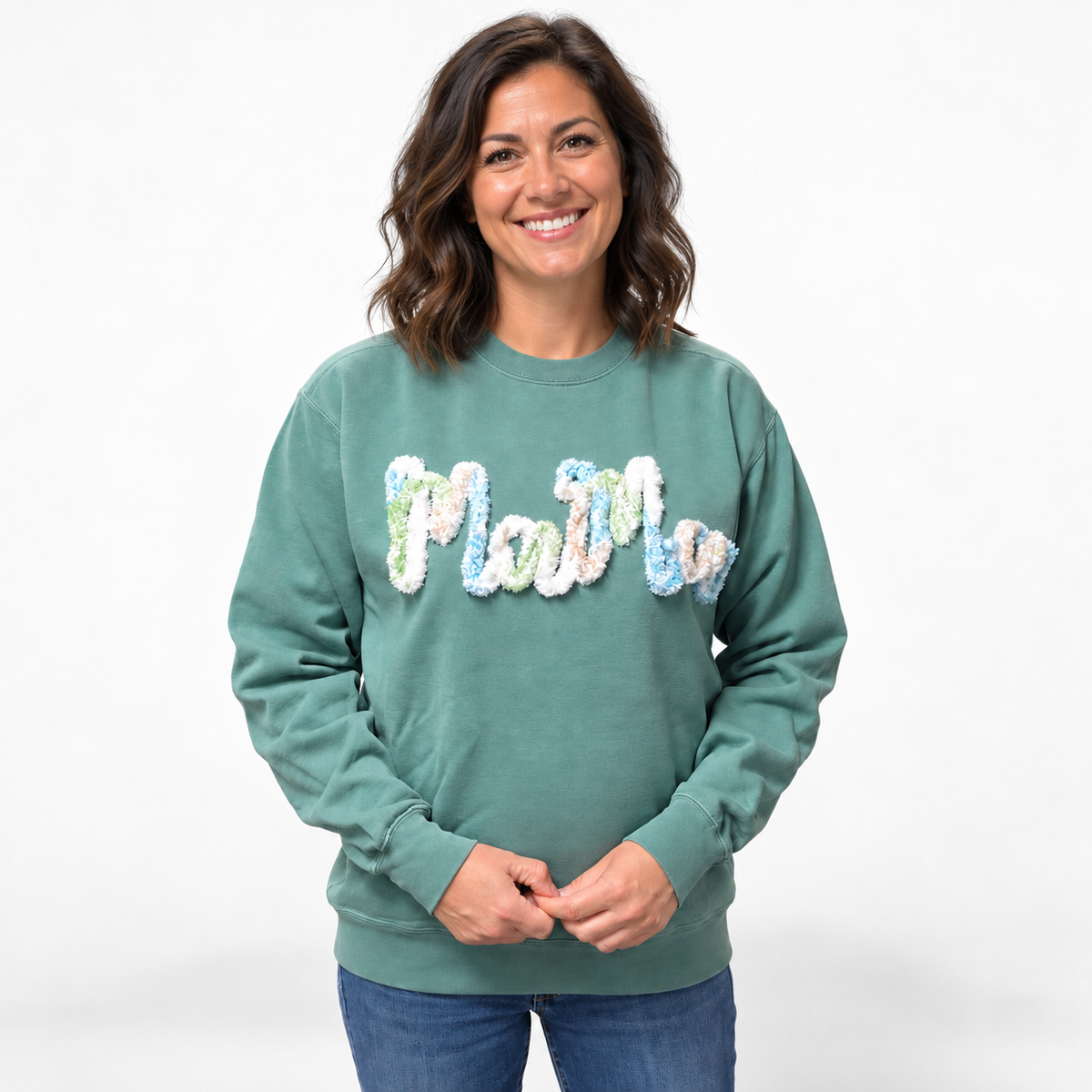 Woman wearing green Comfort Colors chenille MAMA embroidered sweatshirt