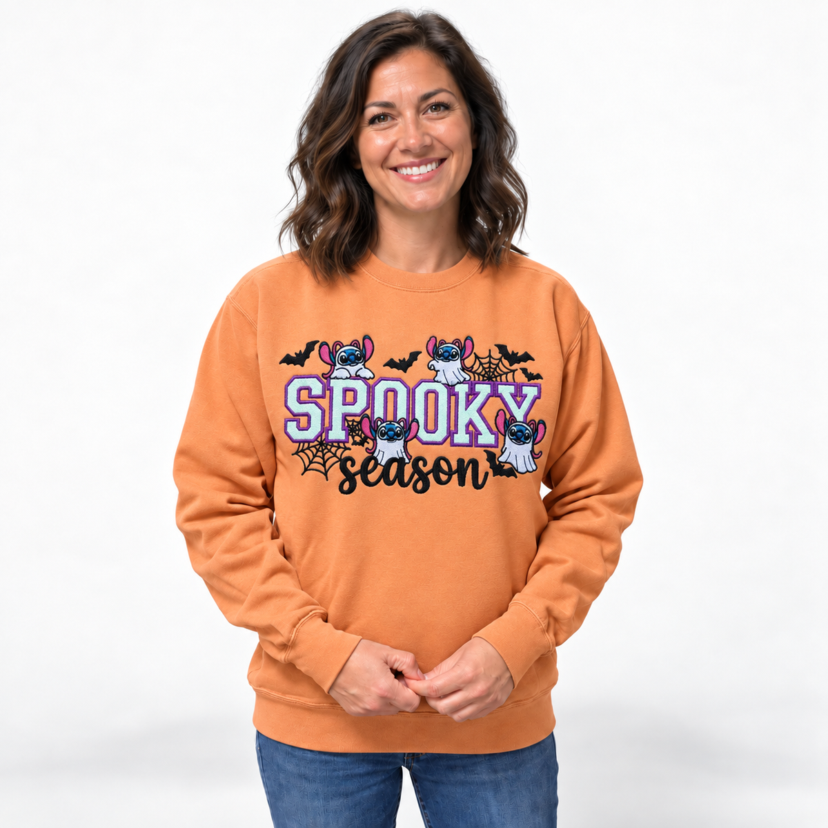 Model wearing a melon Spooky Season embroidered Gildan crewneck